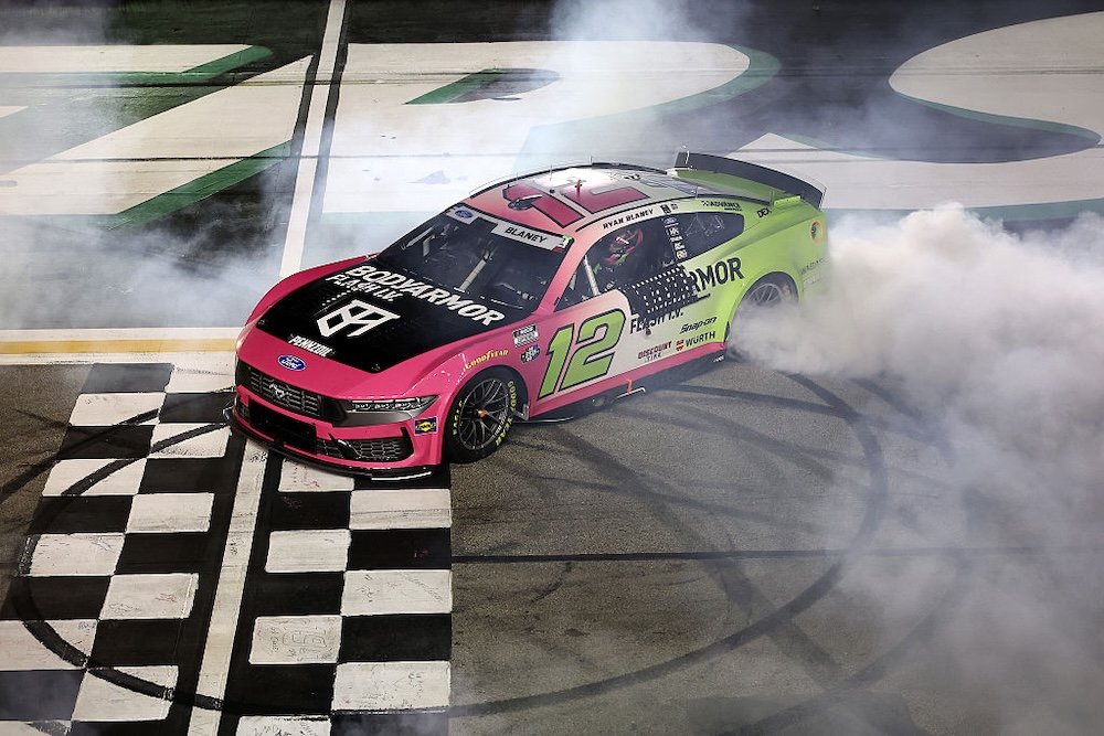 HAMPTON, GEORGIA - JULY 12: Ryan Blaney, driver of the #12 BODYARMOR FLASH I.V. Ford, celebrates with a burnout after winning the NASCAR Cup Series Quaker State 400 Available at Walmart at EchoPark Speedway on July 12, 2026 in Hampton, Georgia. (Photo by Meg Oliphant/Getty Images)